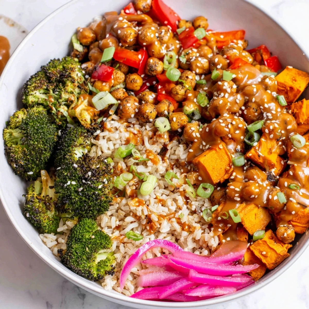 Vibrant Bold Sauce Drizzle Bowls topped with roasted veggies and flavorful sauces.  