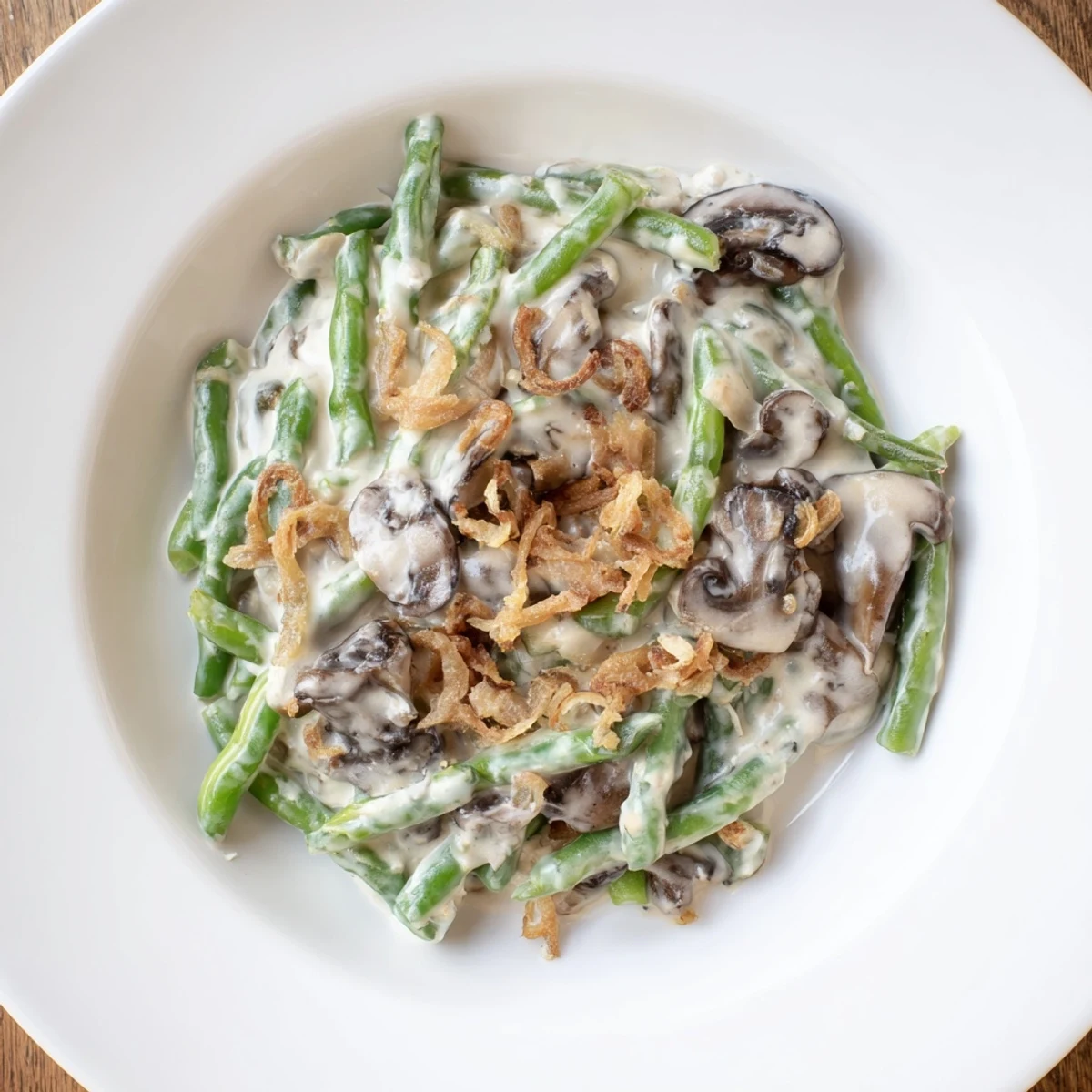 Creamy Old-School Green Bean Casserole with golden onions, a comforting American classic, ready to serve.