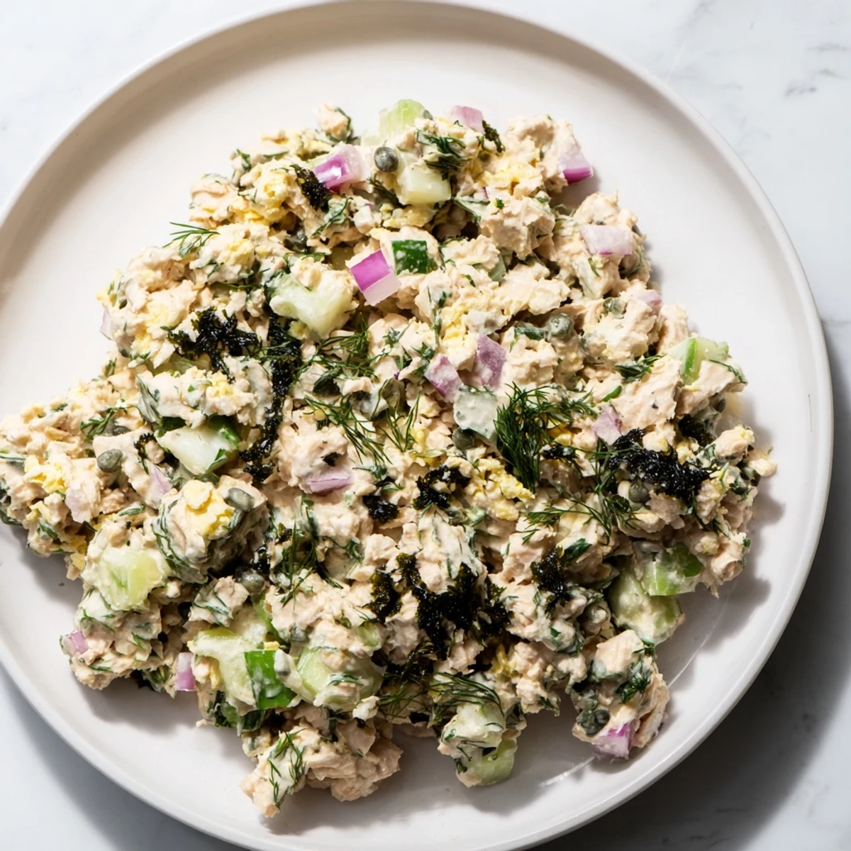 Forkful of flavorful chickpea tuna salad, ready to enjoy as a light and healthy lunch.