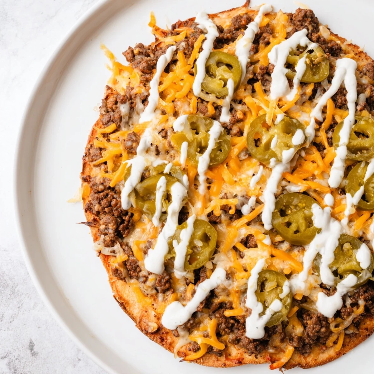 Ground Beef Taco Pizza: A close-up shows the bubbly cheese and savory taco beef topping.