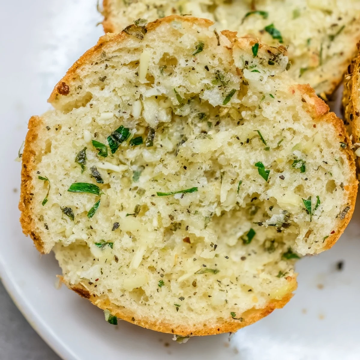 Close-up of baked cloud bread savory toast; a gluten-free savory treat sprinkled with fresh chives.