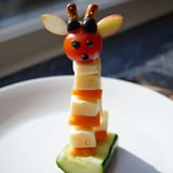 This fun and colorful Long-Necked Giraffe Snack Tower features cheddar and gouda cheese layers topped with a pretzel neck.