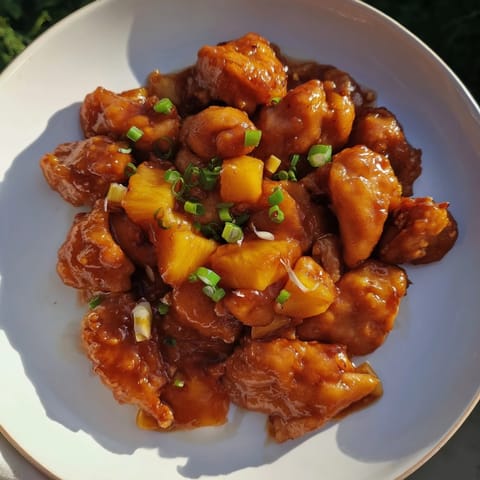 Golden-brown chicken chunks swimming in a sweet and tangy glaze of Brown Sugar Pineapple Chicken.