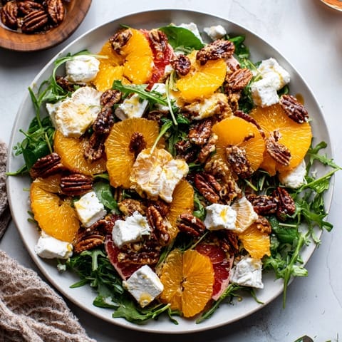 Fresh Winter Citrus & Candied Pecan Salad with glistening honey-citrus dressing and crunchy pecans.