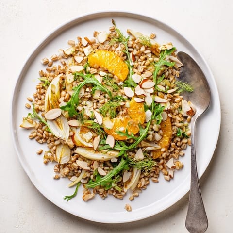 Bright Mediterranean flavors in a bowl of farro salad with fennel, oranges, and almonds.