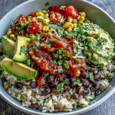Vibrant plant-based taco bowl with fresh salsa and seasoned black beans.