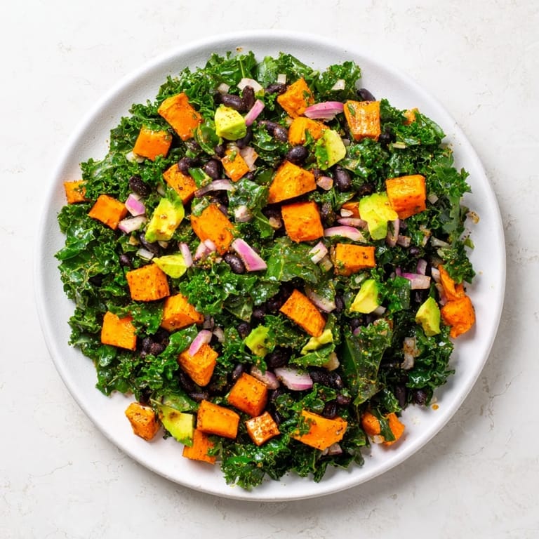 Bright and colorful Massaged Kale Salad featuring black beans, ready for a healthy lunch.