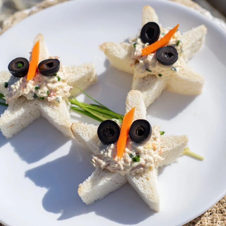 These irresistible Mini Starfish Sandwiches feature olive eyes and caper details, ready for a party.